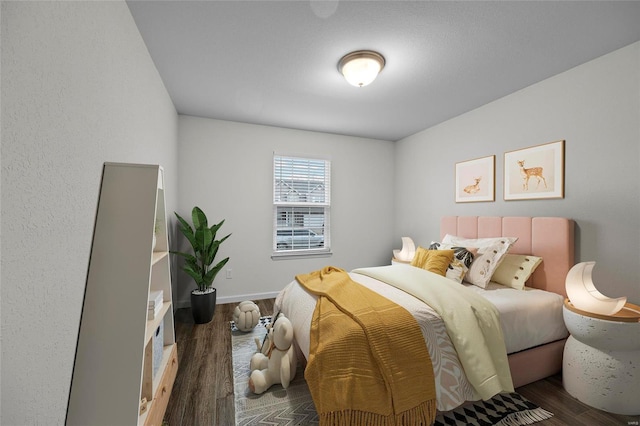 bedroom featuring dark hardwood / wood-style flooring