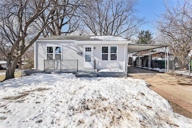 view of front of property with a carport