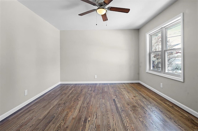 unfurnished room with dark wood-type flooring and ceiling fan