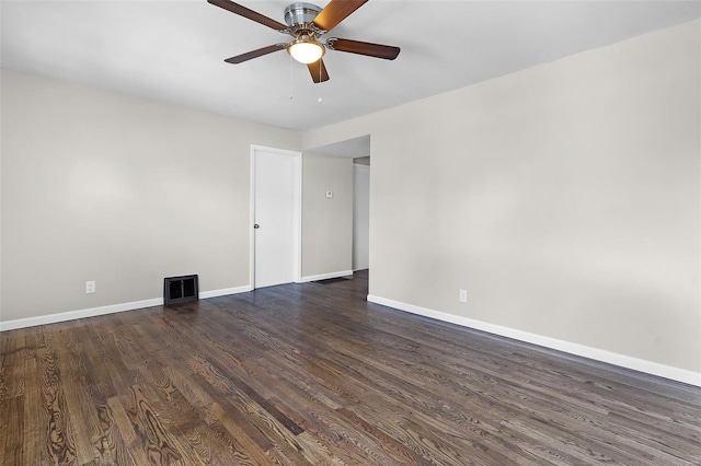 spare room featuring ceiling fan and dark hardwood / wood-style floors