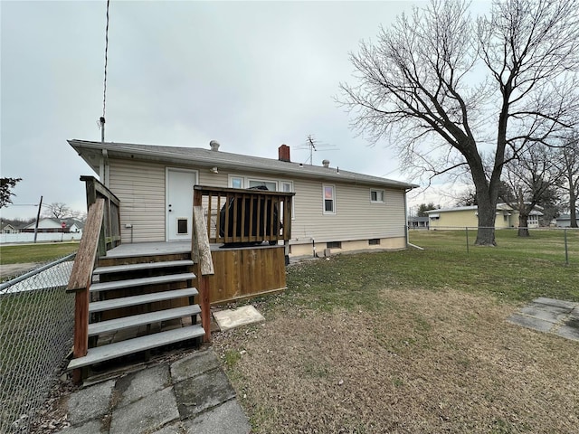 back of property featuring a yard and a deck