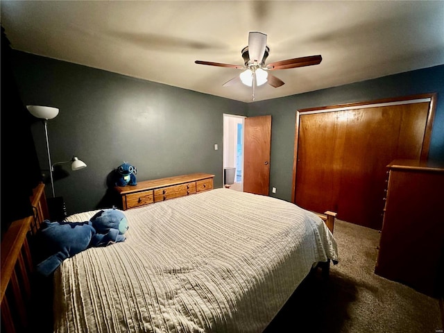 carpeted bedroom with ceiling fan and a closet