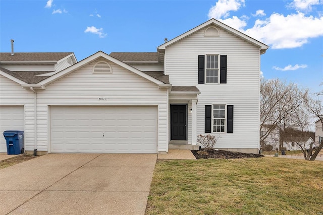 front of property with a garage and a front lawn