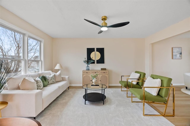 living room with hardwood / wood-style flooring and ceiling fan