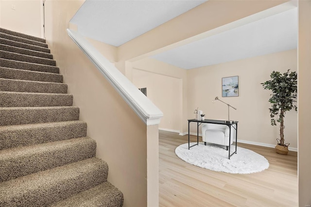 stairway featuring hardwood / wood-style flooring