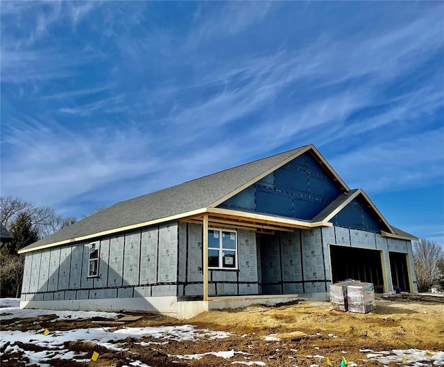 unfinished property with a garage