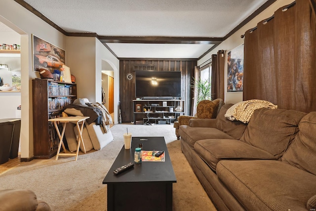 carpeted living room featuring beamed ceiling, crown molding, and a textured ceiling