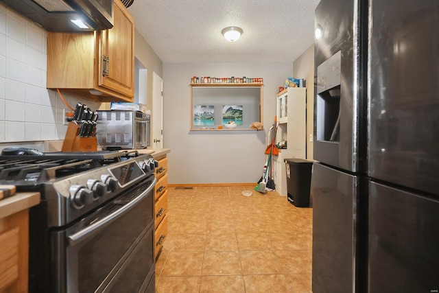 kitchen with refrigerator with ice dispenser, decorative backsplash, double oven range, exhaust hood, and a textured ceiling