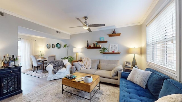 living room with crown molding, ceiling fan, and wood-type flooring