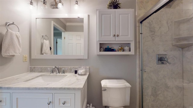 bathroom with vanity, a shower with shower door, ornamental molding, and toilet