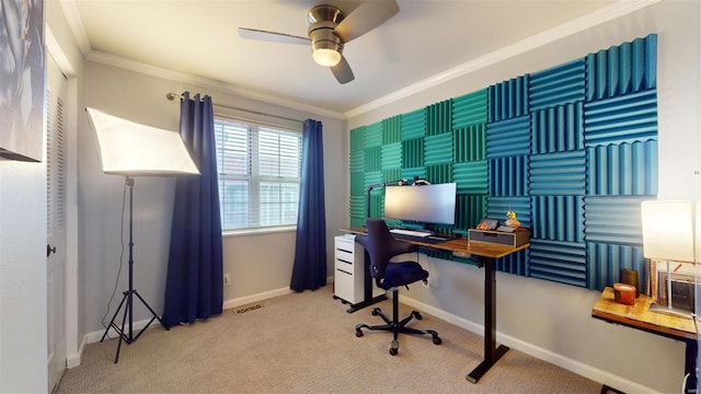 carpeted office with ornamental molding and ceiling fan