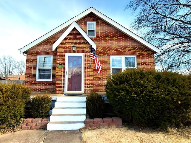 view of front of home featuring brick siding