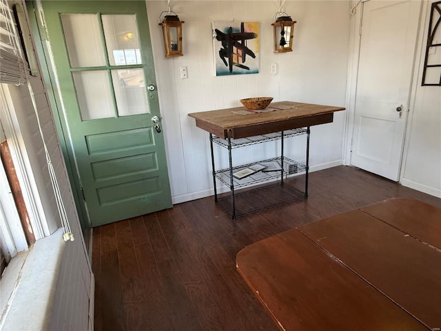 doorway with dark hardwood / wood-style floors