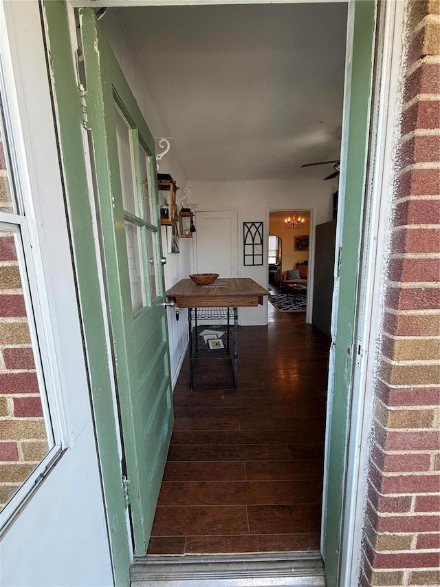 hallway featuring dark hardwood / wood-style flooring