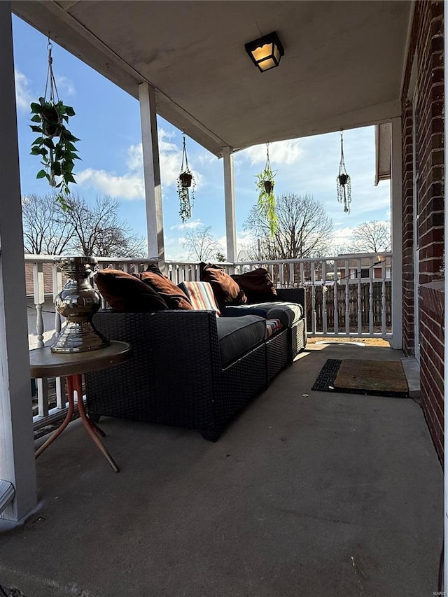 view of patio featuring outdoor lounge area and a balcony