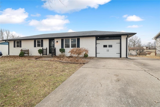 single story home with a garage and a front yard