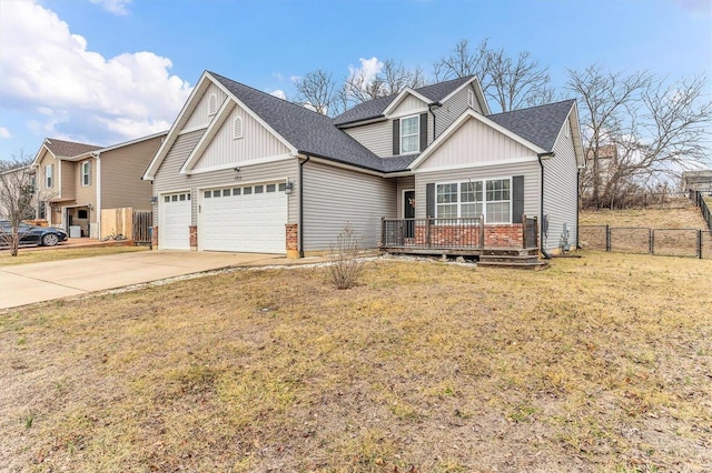 view of front of house with a garage and a front lawn