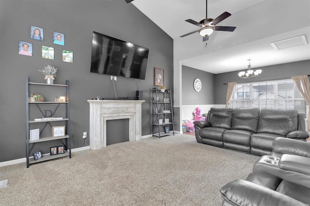 living room with ceiling fan with notable chandelier, lofted ceiling, and carpet floors