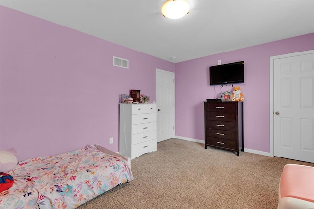 bedroom with light carpet