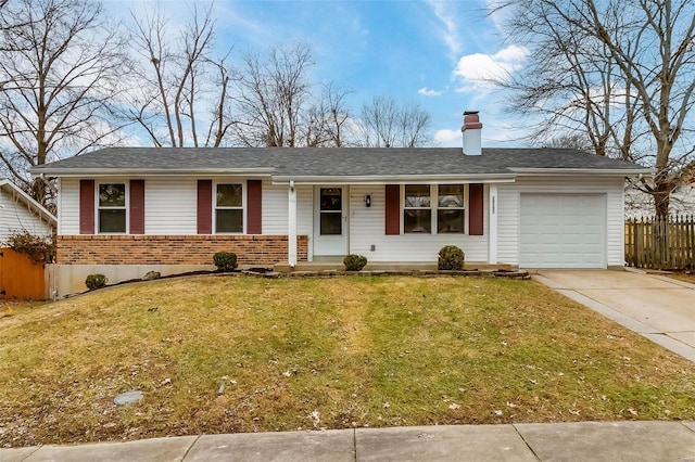 ranch-style house with a garage and a front lawn