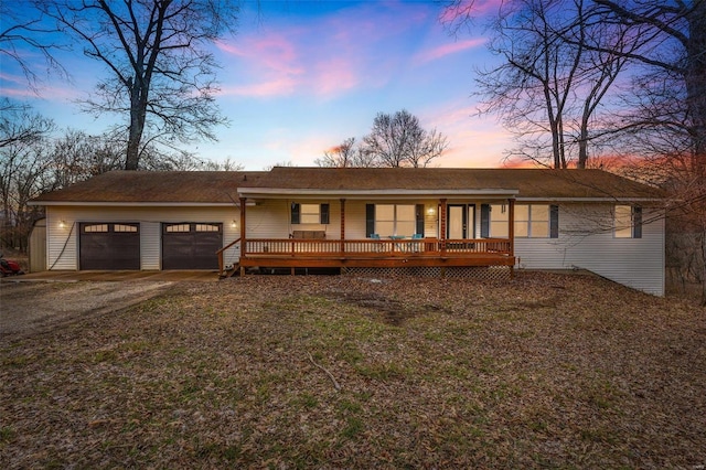 ranch-style home featuring a garage