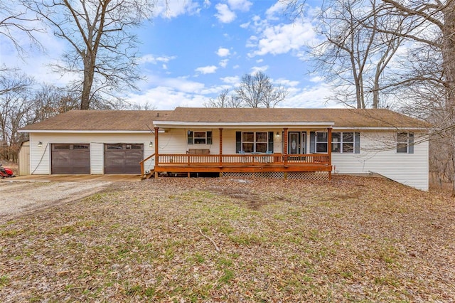 ranch-style house featuring a garage and a porch