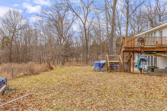 view of yard featuring a wooden deck