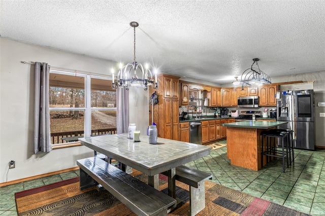 tiled dining space featuring a notable chandelier and a textured ceiling