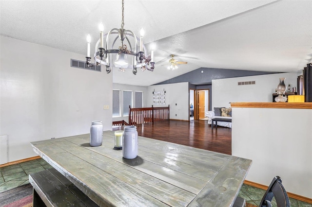 dining room featuring lofted ceiling, hardwood / wood-style floors, ceiling fan with notable chandelier, and a textured ceiling