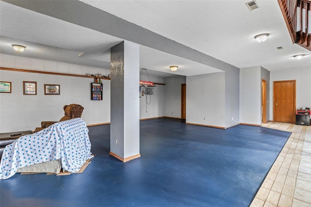 interior space with a textured ceiling