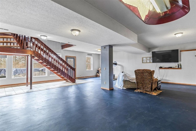 basement featuring a textured ceiling