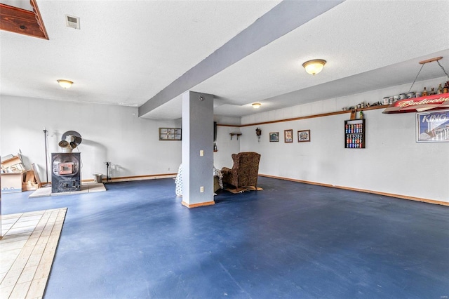 basement featuring a textured ceiling