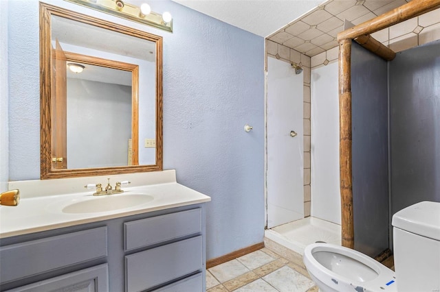 bathroom featuring a bidet, vanity, toilet, and a shower