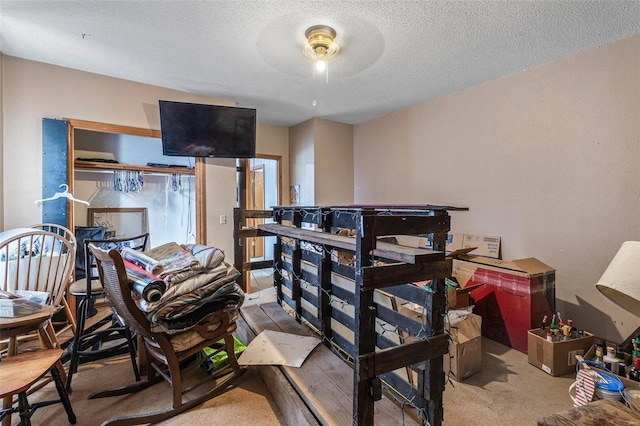 carpeted bedroom featuring a textured ceiling