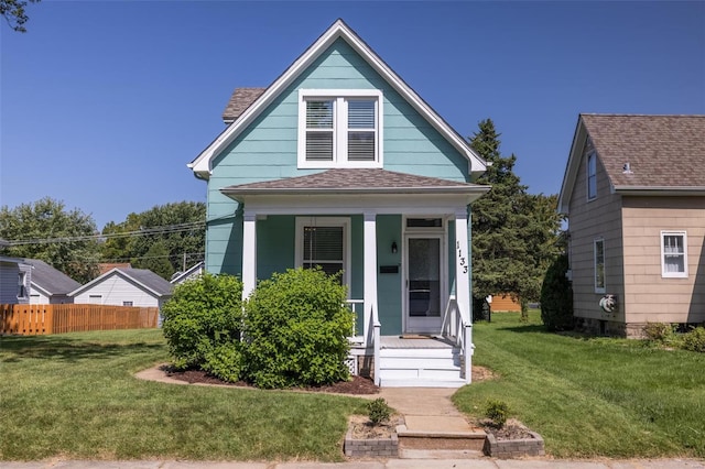 bungalow featuring a front lawn and a porch