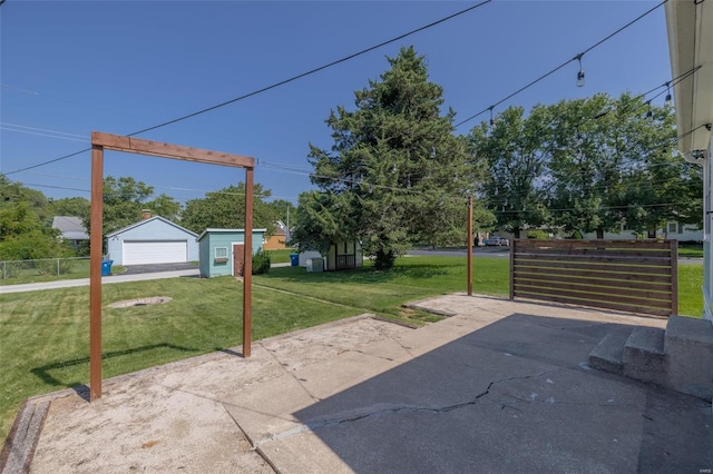 view of patio / terrace featuring an outbuilding and a garage