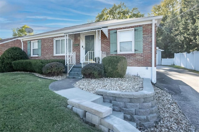 ranch-style home with a front yard