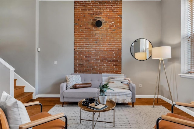 living room featuring baseboards and wood finished floors