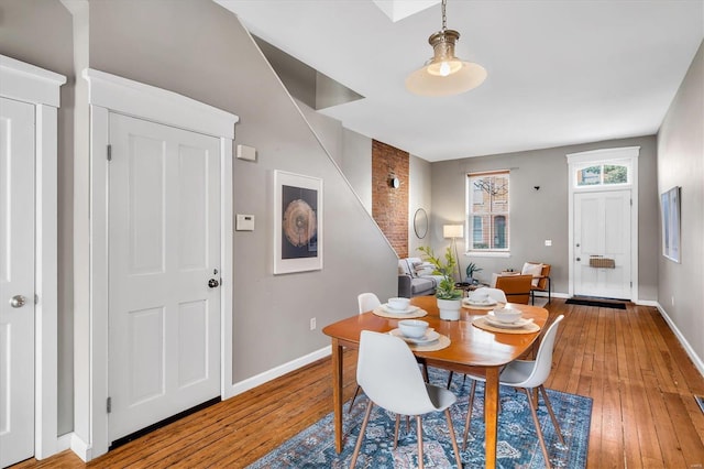 dining room featuring baseboards and light wood-style floors