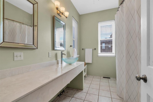 full bathroom with visible vents, vanity, and tile patterned floors