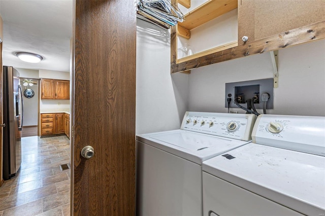 washroom featuring washer and dryer