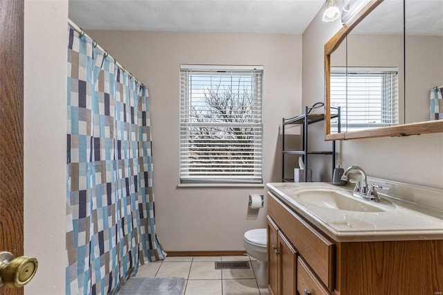 bathroom featuring tile patterned flooring, vanity, a shower with curtain, and toilet