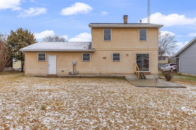 back of property featuring a patio