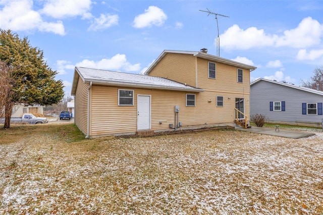 back of house with a patio