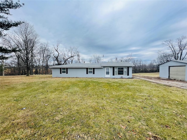 rear view of property featuring a yard