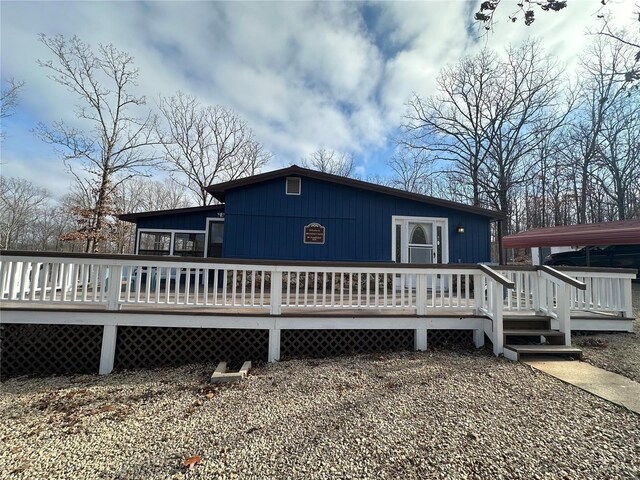 rear view of house with a deck