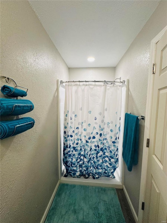 bathroom with shower / bath combination with curtain