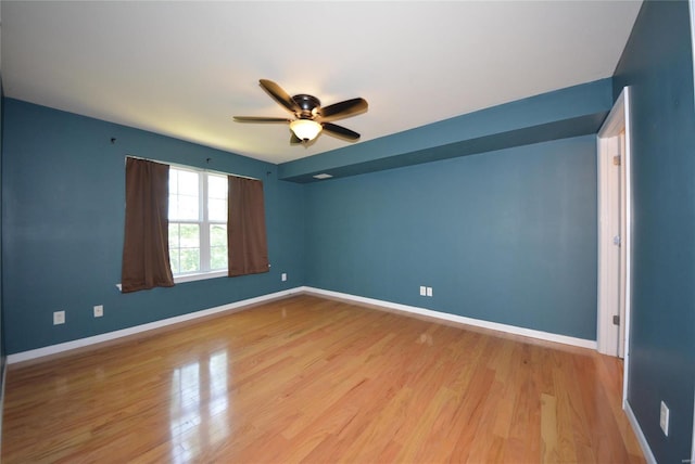 spare room with ceiling fan and light hardwood / wood-style flooring