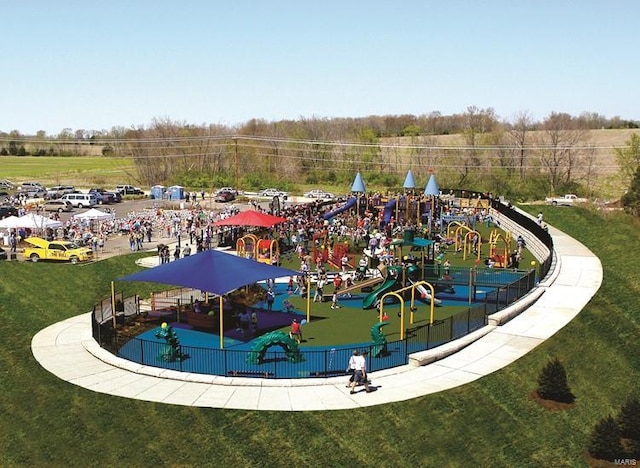 view of pool featuring a playground and a lawn