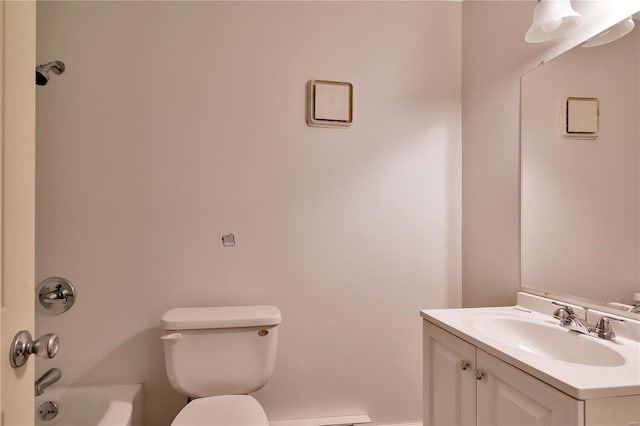 bathroom with vanity, toilet, and a washtub